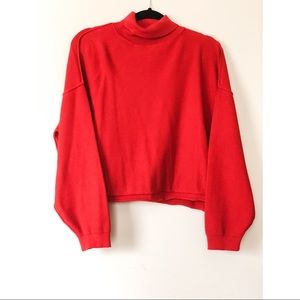 Red long sleeve sweater.